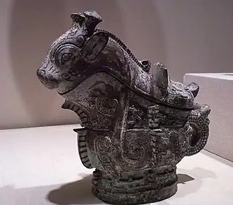 Ritual wine server (guang); 1100 BC; Indianapolis Museum of Art.[9][10]