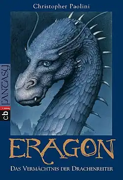 Head and neck of a dragon. She has spikes on her scaly curved neck and antler-like projections over her eyes. Also a light teal color.