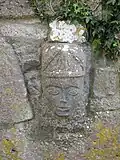 Carved head on the inner wall.