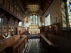The chancel from the rood screen. The sanctuary and chancel are by Ninian Comper in the early 20th Century.