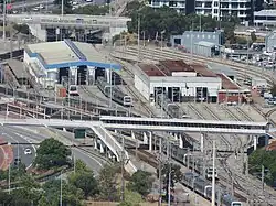 Long shot of train depot from a skyscraper