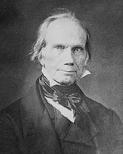 Black-and-white head shot of Clay