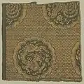Three-clawed jianglong in roundel, Yuan dynasty