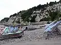 Deckchairs on beach at Beer, Devon, England, both open and stacked, in 2007
