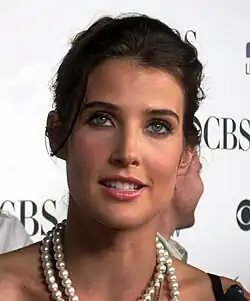 A brunette woman smiles