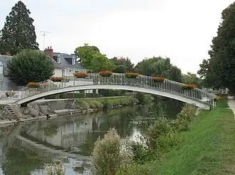 The curved metal footbridge.