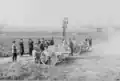 Spanish commission examining 2 different 75-mm light field guns on the Harfleur range, 1904