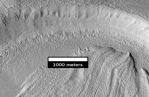 Concentric Crater Fill Close-up of near the top of previous image. The surface debris covers water ice.
