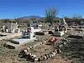 Graves at the Continental Cemetery with the Santa Rita Mountains in the background