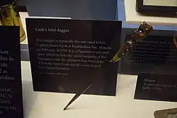 A dagger in a museum. A notice states the dagger is of Spanish origin and Hawaiians might have acquired it by trade