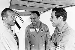 Standing around laughing in flight suits