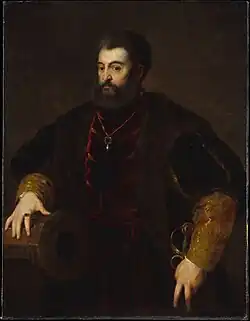 The portrait displays Alfonso I d'Este facing the left and leaning against military artillery.