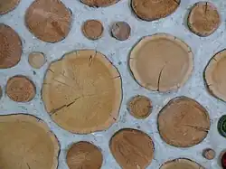 Cordwood masonry wall detail. This alternative building method is called cordwood masonry, cordwood construction or stackwall because the wall resembles a stack of cordwood. Source: Rob Roy, Earthwood Building School. http://www.cordwoodmasonry.com