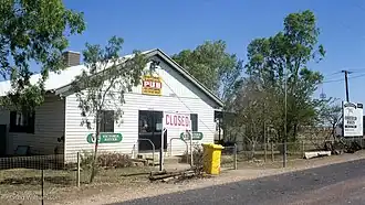 The historic Corfield Pub. A sign promoting the Corfield Cup can also be seen.
