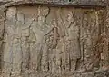 3rd century CE relief of the investiture of Ardashir I (center left) receiving the ring of power and the diadem from the god Ahura Mazda (center right). Between them are Ardashir's grandson Hormizd I and a deity (probably Mithra). On the left, Ardashir's son, Shapur I. On the right, two women.