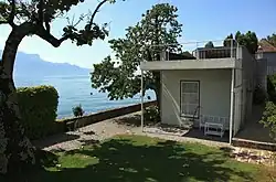 A house at the edge of a body of water