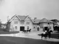 The stables and garage, which survives