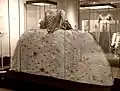 [136]"Mantua gown made from an ivory silk brocaded in a pattern of stylised flowers and leaves."