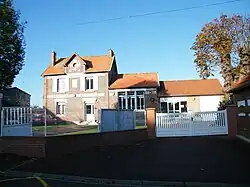 The town hall and echool in Courtemanche