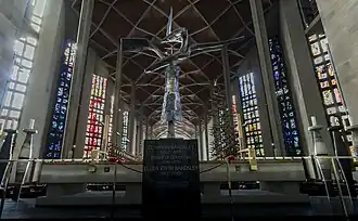 View from altar, showing stained glass windows by Lawrence Lee, Keith New and Geoffrey Clarke, and Clarke's bronze Altar Cross.