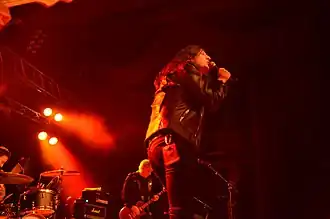 Gould (front) and Miles (back) performing with Creeper in 2016.