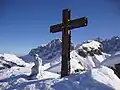 Cross and Cristo Pensante statue on summit