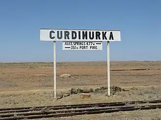 Sign at Curdimurka rail siding, on the former Central Australia Railway, at Stuarts Creek (2012)