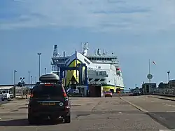 Large roll-on roll-off ferry carrying passengers and vehicles across open water