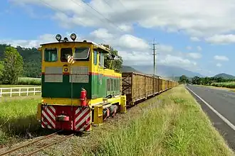 Cane tram travelling through Killaloe beside the Captain Cook Highway, 2015