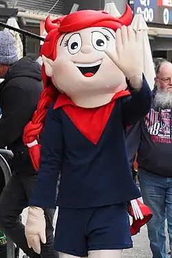 A person in a costume walking around the venue