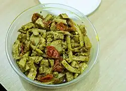 Nepali pickle made of Dalle Khursani (round chilies) and Tama (fermented bamboo shoot pickle)