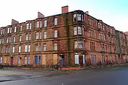 Victorian sandstone tenements in Ardenlea Street that were originally renovated as part of the GEAR (Glasgow Eastern Area Renewal) scheme in the late 1970s, but had their residents systematically rehoused, which led them to fall into a dilapidated state once more. They were totally demolished as part of the 2014 Commonwealth Games Athletes' Village masterplan by RMJM.