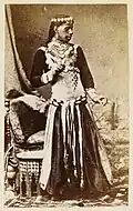 A khawal slave (dancing boy) from Upper Egypt dressed in a female dancing costume (c. 1870).