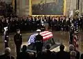 Coughlin (at podium) delivering invocation at memorial service for former President Gerald Ford, 2006.