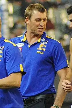 Male football coach walking