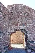 Fortress gate with depictions of lions above