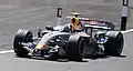 David Coulthard driving the RB3 at the 2007 British Grand Prix, with the one-off Wings for Life livery.