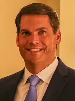 Portrait of Geoff Duncan in suit and blue necktie.