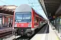 2. Generation Doppelstockwagen in DB Verkehrsrot&nbsp;[de] colours on a Rostock S-Bahn service (July 2013)