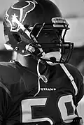 A black and white picture of a football player