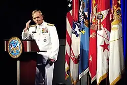 Admiral Eric T. Olson salutes Sergeant First Class Leroy Petry at a ceremony at The Pentagon.