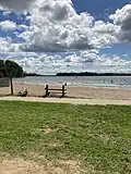 Beach with the dam visible to the left.