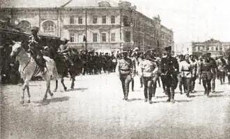 Parade of the All-Russian Socialist Republic on Alexander Square on July 3, 1919, with the Stolichnye Numera Hotel in the background