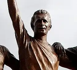 A head and upper shoulders shot of a statue of a footballer