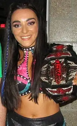 Three-time champion Deonna Purrazzo with the red-accent variant of the third design (2020–2024)