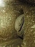 Rolling stone door in the underground town of Derinkuyu, Cappadocia, Turkey