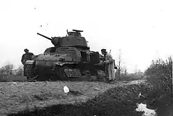 A German Beute tank (Somua S35) knocked out in operations in eastern Bosnia is inspected by partisans, December 1943