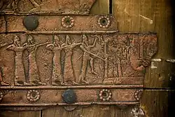 Detail of an embossed scene on bronze plate showing Assyrian army attacking a city. From a Balawat gate, Iraq, 859–824 BCE. Ancient Orient Museum, Istanbul