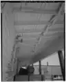 Cross bracing between joists or rafters strengthens the members by preventing sideways deflection.