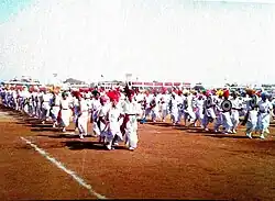 A lively group dance celebrating the defeat of evil during the Hindu festival of Holi. Men carouse, sing riotously to the rhythmic beat of the chang instrument, and perform folk songs called Dhamaal.